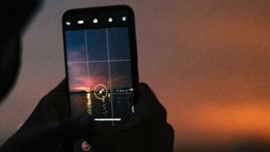 a person taking a picture with a cell phone